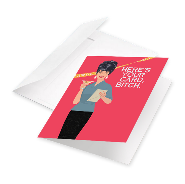 A greeting card that reads: Here's your card bitch, pictured with a white envelope. 